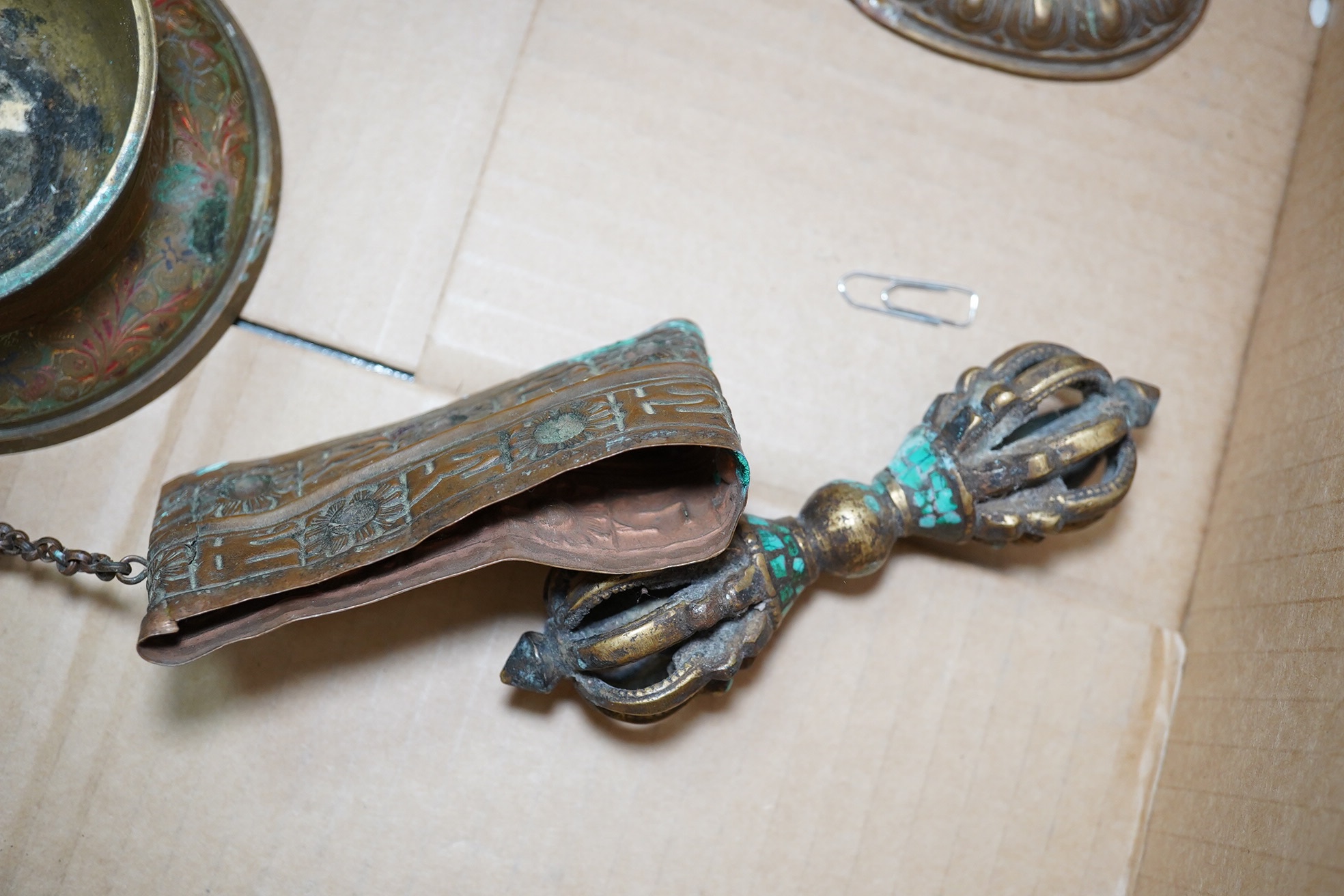 A group of Tibetan brass and mixed metal artefacts to include a brass vase with cabochon inset stones and figures of deities, largest 22cm high. Condition - mostly fair